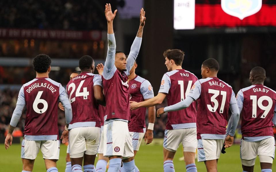 Aston Villa's Ezri Konsa (centre) celebrates scoring their side's second goal of the game with team-mates during the Premier League match at Villa Park, Birmingham