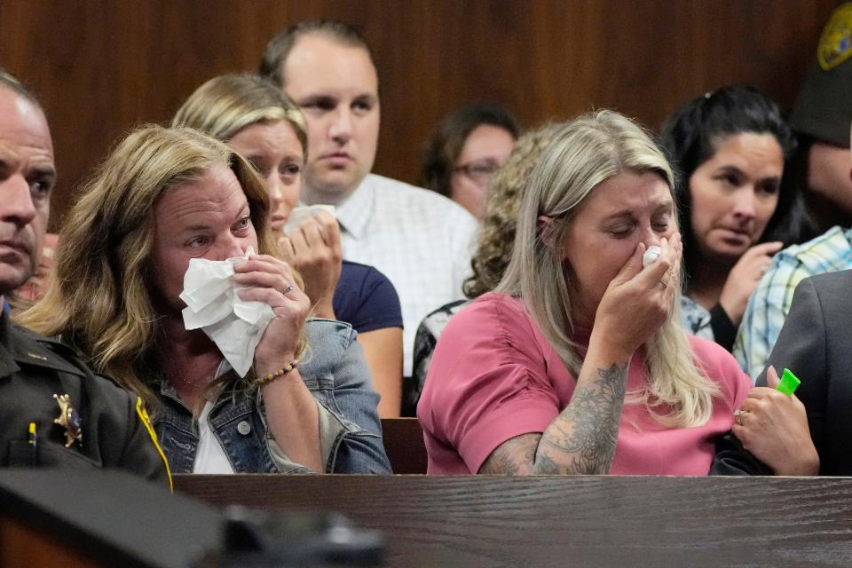 Spectators react during a hearing on Thursday, July 27, 2023, in Pontiac, Mich., as they view video of the Oxford High School shooting where Ethan Crumbley killed four students and injured six others and a teacher in November 2021. A judge is hearing evidence to support a request to sentence the teen school shooter to life in prison.