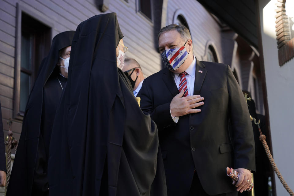 Secretary of State Mike Pompeo speaks with Ecumenical Patriarch Bartholomew I, the spiritual leader of the world's Orthodox Christians, as he departs the Patriarchal Church of St. George in Istanbul, Tuesday, Nov. 17, 2020. Pompeo's stop in Turkey is focused on promoting religious freedom and fighting religious persecution, which is a key priority for the U.S. administration, officials said. (AP Photo/Patrick Semansky, Pool)