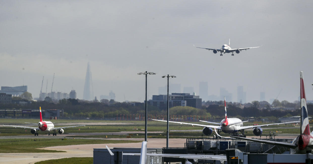A British Airways plane lands on the northern runway at Heathrow Airport. The airport is running only one operational runway as the UK continues in lockdown to help curb the spread of the coronavirus. (Photo by Steve Parsons/PA Images via Getty Images)