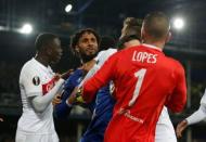 Soccer Football - Europa League - Everton vs Olympique Lyonnais - Goodison Park, Liverpool, Britain - October 19, 2017 Everton's Ashley Williams clashes with Lyon's Anthony Lopes as teammates intervene REUTERS/Andrew Yates