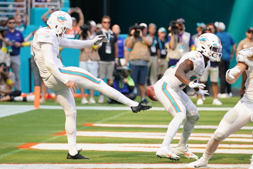 September 25, 2022:  Miami Dolphins punter Thomas Morstead (4) punts the ball into the backside of wide receiver Trent Sherfield (14) resulting in a safety for the Buffalo Bills during the second half at Hard Rock Stadium.020.JPG