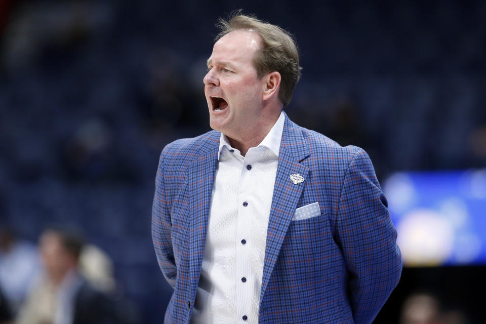 Mississippi head coach Kermit Davis yells to his players in the first half of an NCAA college basketball game against Georgia in the Southeastern Conference Tournament Wednesday, March 11, 2020, in Nashville, Tenn. (AP Photo/Mark Humphrey)