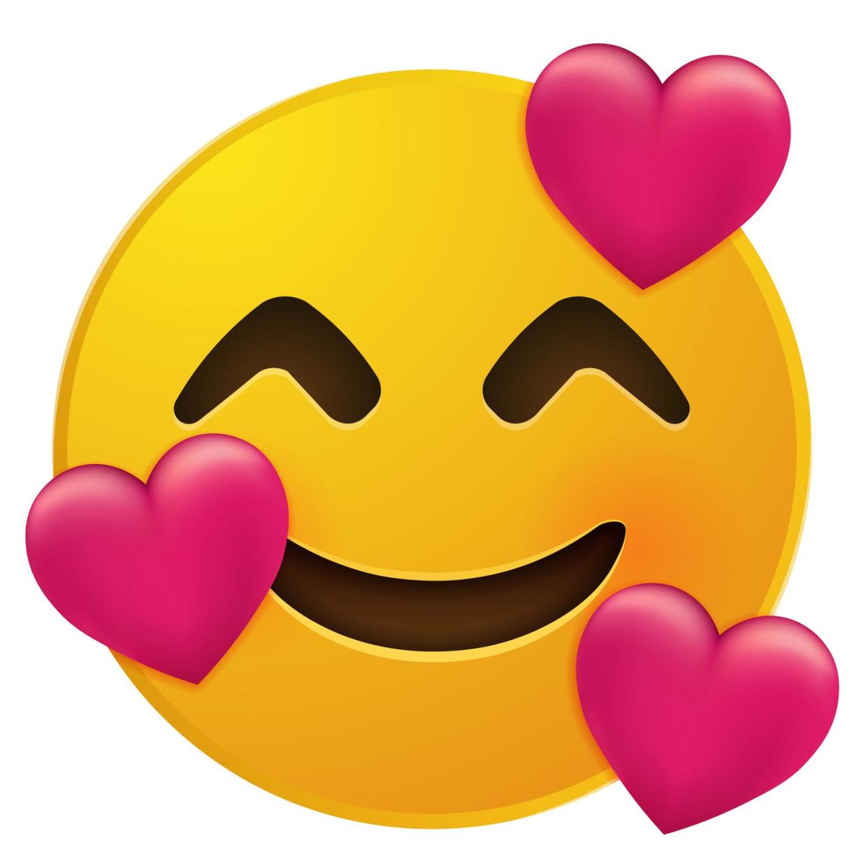 yellow smiling face emoji with smiling eyes and three hearts