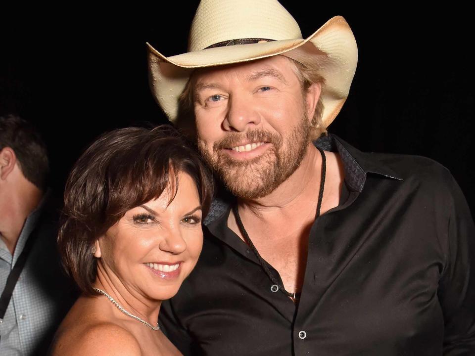 <p>Jeff Kravitz/ACMA2018/FilmMagic</p> Toby Keith and Tricia Lucus attend the 53rd Academy of Country Music Awards on April 15, 2018 in Las Vegas, Nevada.
