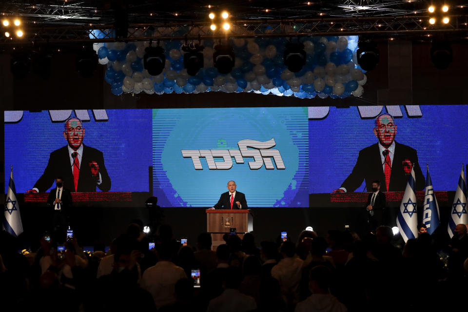 Israeli Prime Minister Benjamin Netanyahu delivers a speech following the announcement of the first exit poll results for the Israeli parliamentary elections, at his Likud party headquarters in Jerusalem, Wednesday, March. 24, 2021. (AP Photo/Maya Alleruzzo)