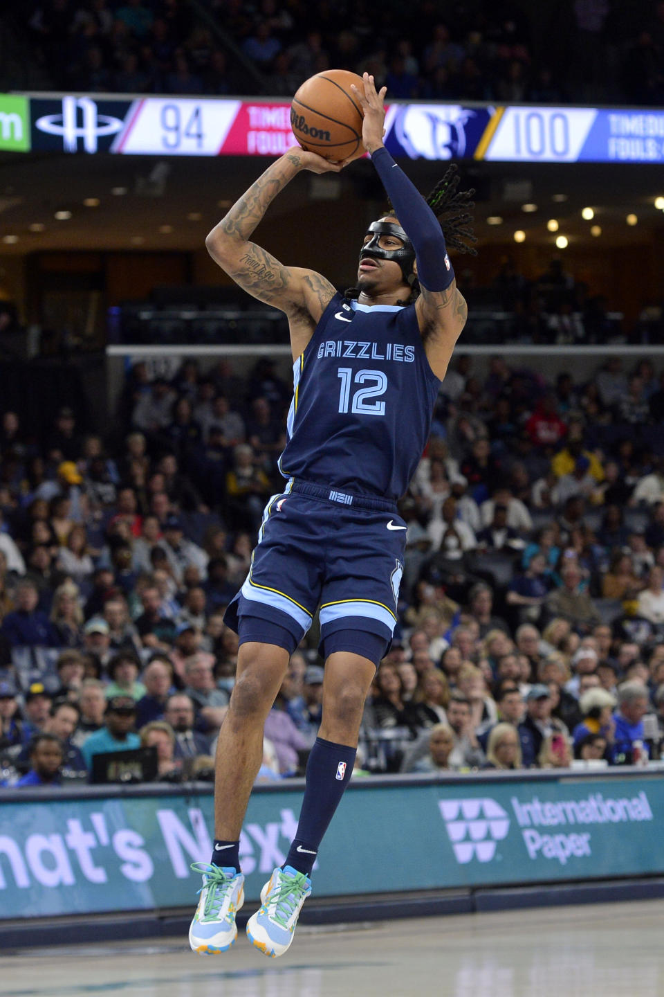 Memphis Grizzlies guard Ja Morant (12) shoots the ball in the second half of an NBA basketball game against the Houston Rockets Wednesday, March 22, 2023, in Memphis, Tenn. (AP Photo/Brandon Dill)