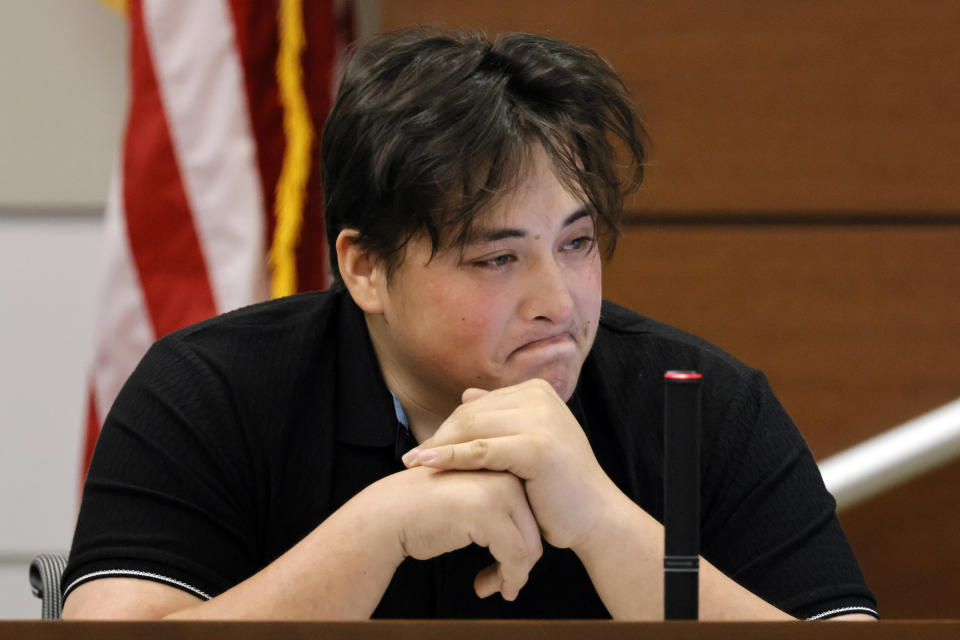 Former Marjory Stoneman Douglas High School student Kyle Laman, who was injured in the 2018 shootings, reacts as surveillance video of the massacre is played in court on the second day of testimony in the case of former MSD High School School Resource Officer Scot Peterson at the Broward County Courthouse in Fort Lauderdale on Thursday, June 8, 2023. Broward County prosecutors charged Peterson, a former Broward Sheriff's Office deputy, with criminal charges for failing to enter the 1200 Building at the school and confront the shooter as he perpetuated the Valentine's Day 2018 Massacre. (Amy Beth Bennett/South Florida Sun-Sentinel via AP, Pool)