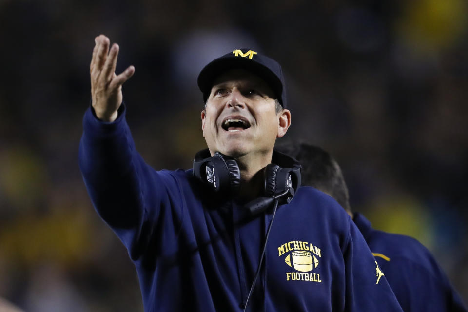 Michigan coach Jim Harbaugh argues a call during the second half of his team's game against Middle Tennessee on Saturday. (AP)