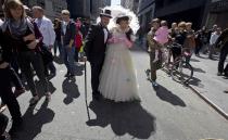 Participants dressed in costume attend the annual Easter Bonnet Parade in New York April 20, 2014. REUTERS/Carlo Allegri (UNITED STATES - Tags: SOCIETY)