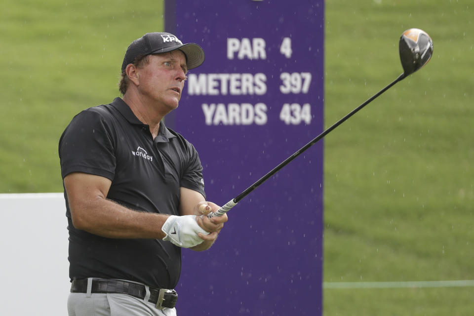 Phil Mickelson fits from the first tee during a practice round at the World Golf Championships-FedEx St. Jude Invitational Wednesday, July 29, 2020, in Memphis, Tenn. (AP Photo/Mark Humphrey)