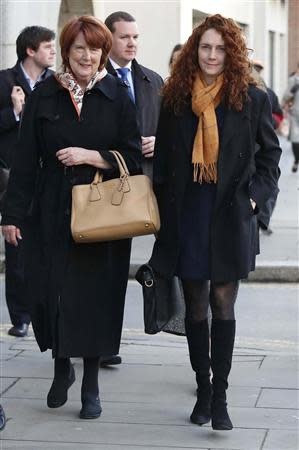 Former News International chief executive Rebekah Brooks (R) arrives with her mother Deborah Wade at the Old Bailey courthouse in London November 14, 2013. REUTERS/Olivia Harris