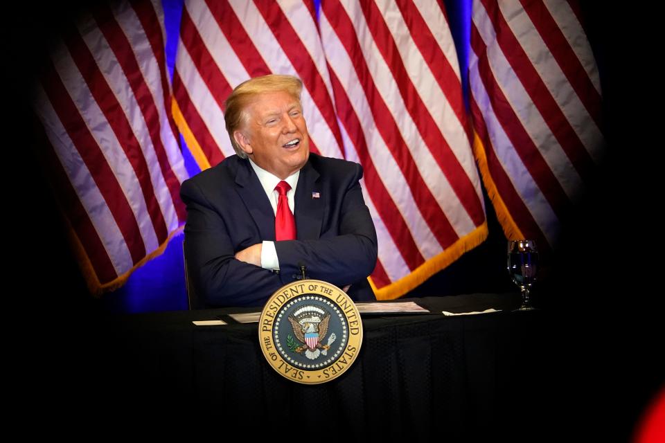 President Donald Trump smiles during a Latinos for Trump Coalition roundtable Sunday in Las Vegas.