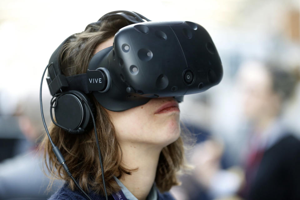 PARIS, FRANCE - FEBRUARY 08:  An visitor wears a Vive virtual reality (VR) headset, manufactured by HTC Corp during the 'Virtuality Paris 2018' show on February 08, 2018 in Paris, France. The second edition of Virtuality Paris, the virtual reality fair, will be held in Paris from 08 to 10 February 2018  (Photo by Chesnot/Getty Images)