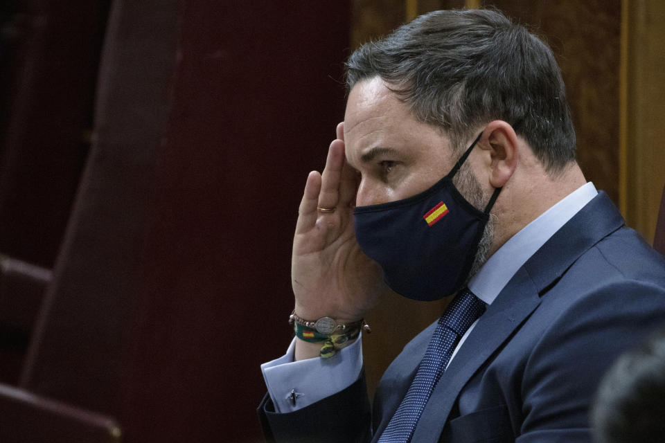 Vox party leader Santiago Abascal gestures during a parliamentary session in Madrid, Spain, Thursday Oct. 22, 2020. Spanish Prime Minister Pedro Sanchez is facing a no-confidence vote in parliament brought by the nation's far-right Vox party. (Pablo Blazquez Dominguez/Pool via AP)