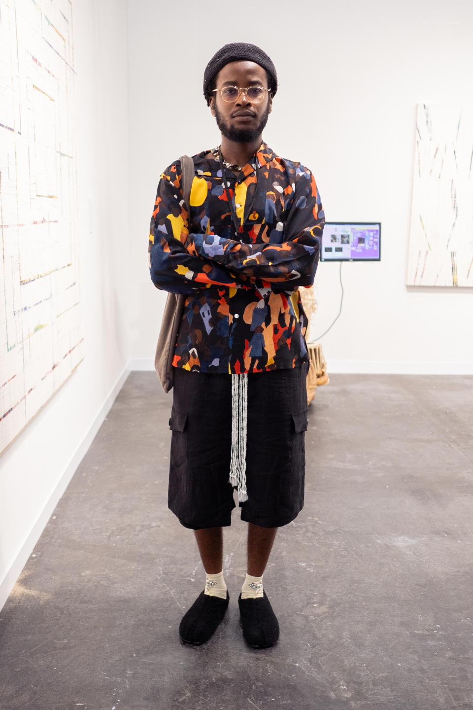 man wearing cool outfit in a gallery in nyc