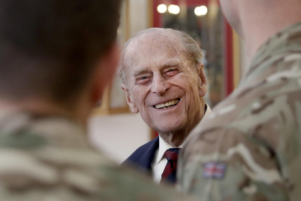 FILE - In this file photo dated Thursday, March 30, 2017, Britain's Prince Philip, in his capacity of Colonel, Grenadier Guards, talks to Sergeants from 1st Battalion Grenadier Guards as he walks in their Mess at Lille Barracks in Aldershot, England. The 99-year-old husband of Queen Elizabeth II, Prince Philip was admitted to King Edward VII Hospital on Tuesday evening as “a precautionary measure” and is expected to remain there for a few days of “observation and rest.” (AP Photo/Matt Dunham, FILE)