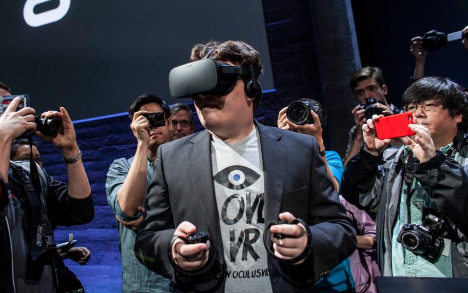 Palmer Luckey, founder and inventor of Oculus VR, demonstrates the Oculus Rift virtual reality headset