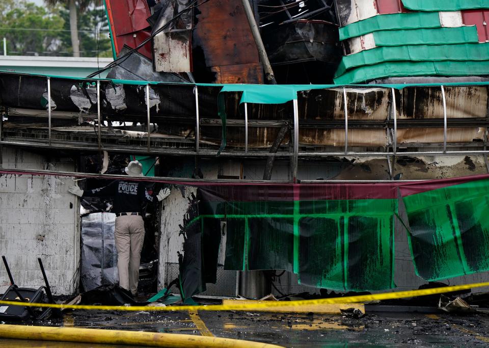 A fire investigator investigates the Pappas Restaurant fire in New Smyrna Beach, Monday, March 18, 2024.