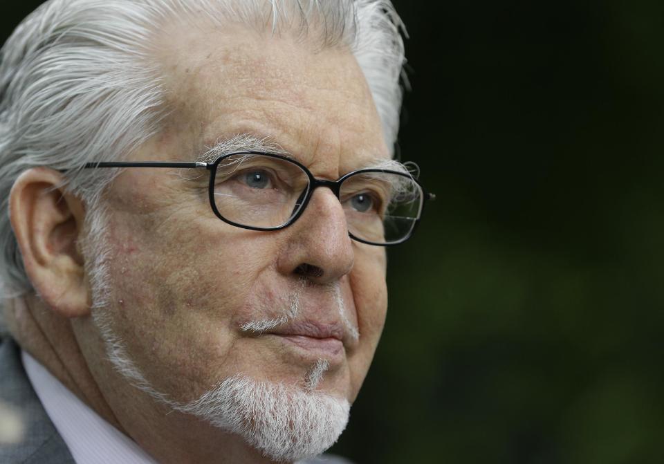 Veteran Australian-British entertainer Rolf Harris who is accused of indecent assault arrives at Southwark Crown Court in London, Friday, May 9, 2014. The 84-year-old is charged with indecently assaulting four girls between 1968 and 1986. The girls ranged in age from 7 or 8 to 19. Harris denies the charges. (AP Photo/Kirsty Wigglesworth)