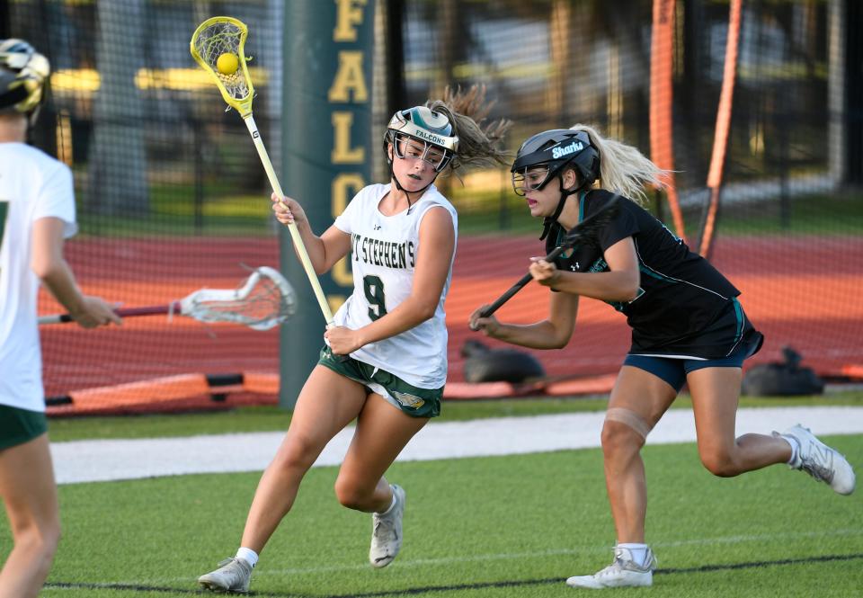 Saint Stephen's Haley Rosa moves around Gulf Coast's Emerson Hill during the teams' Class 1A-Region 3 semifinal on Tuesday at Saint Stephen's