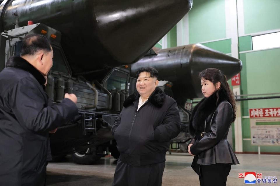 North Korean leader Kim Jong Un and his daughter Ju Ae inspect a missile launcher production facility in a photo released in January 2024 (EPA/KCNA)