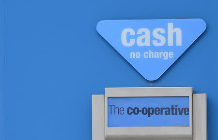 FILE PHOTO: A cash point machine is seen outside a branch of the Co-operative Bank in central London May 10, 2013. REUTERS/Toby Melville