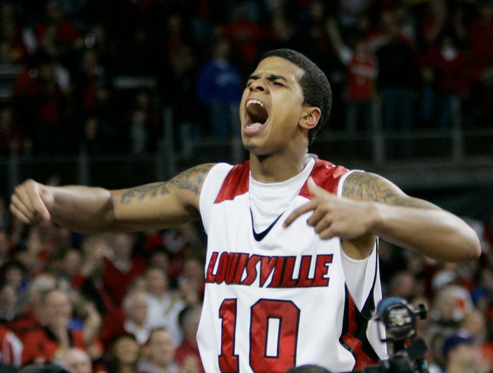 Louisville's Edgar Sosa yells to the crowd after hitting the game-winning basket to defeat intrastate rival Kentucky 74-71 in their NCAA college basketball game in Louisville, Ky., Sunday, Jan. 4, 2009. (AP Photo/Ed Reinke)