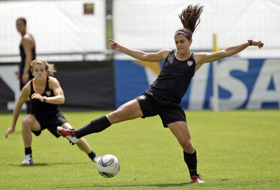 Alex Morgan, right, controls the ball next to teammate Kelley O'Hara.