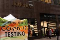 People walk outside of Jefferies Financial Group offices in Manhattan, New York City