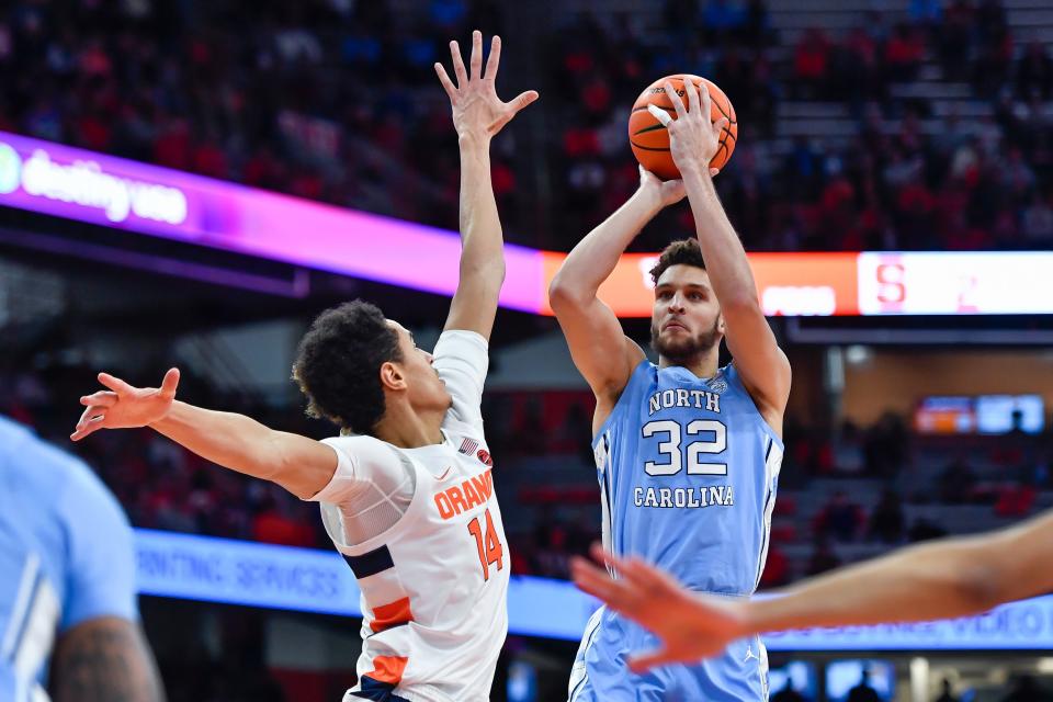 North Carolina forward Pete Nance shoots over Syracuse center Jesse Edwards during the first half in Syracuse, N.Y., Tuesday, Jan. 24, 2023.