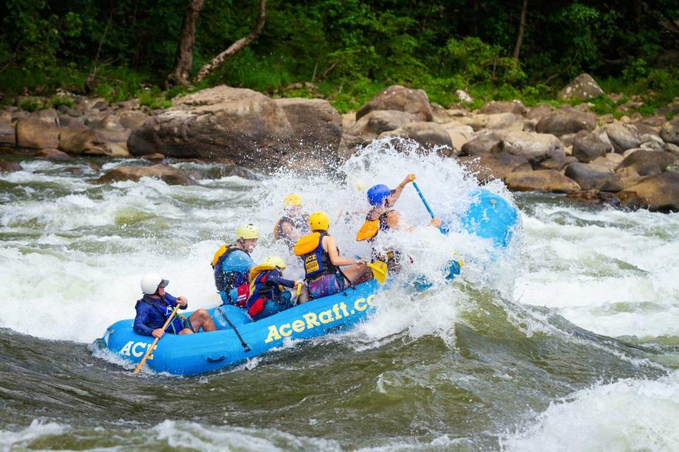 Whitewater rafting in a blue raft on the New River