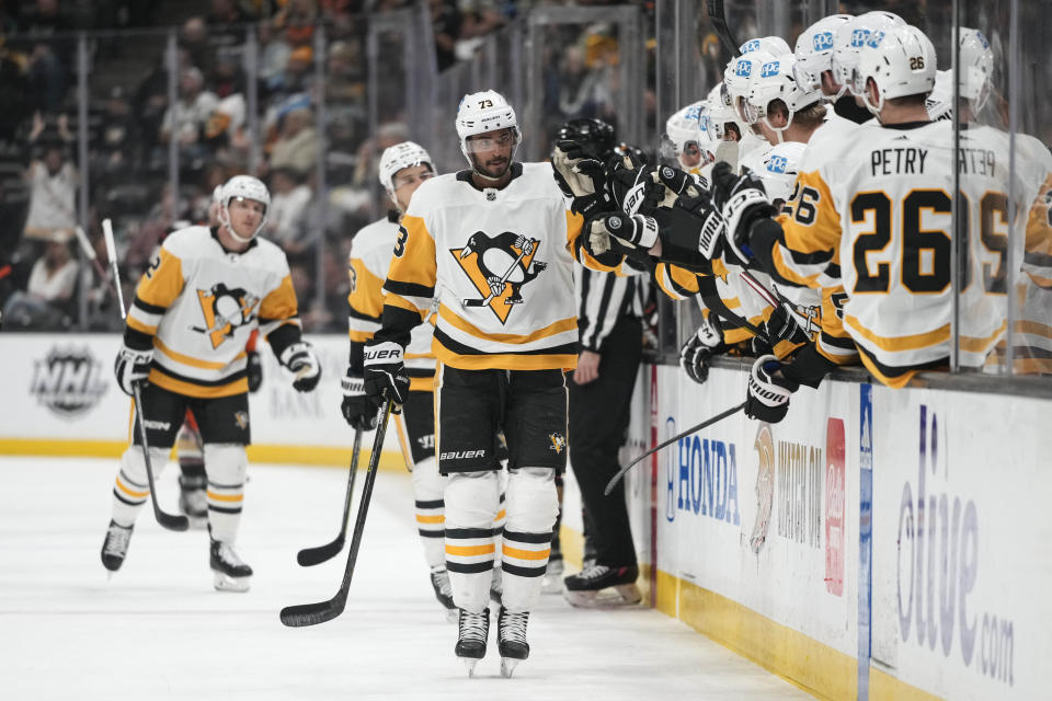 Pittsburgh Penguins' Pierre-Olivier Joseph (73) celebrates with teammates after his goal during the first period of an NHL hockey game against the Anaheim Ducks, Friday, Feb. 10, 2023, in Anaheim, Calif. (AP Photo/Jae C. Hong)
