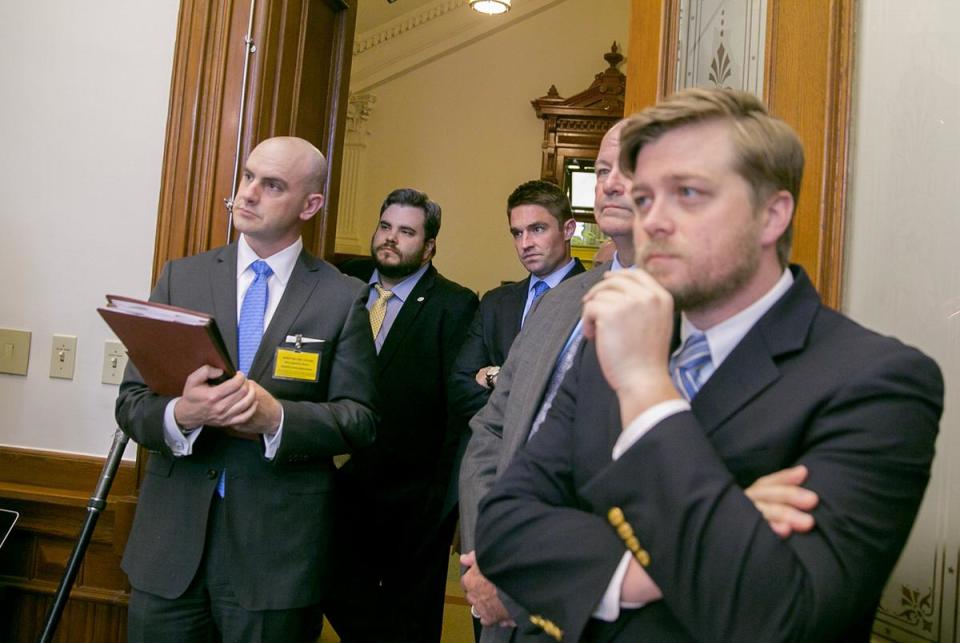 Rep. Jonathan Stickland R-Bedford and Rep. Jeff Leach R-Plano stand just outside the Senate press room during a press conference by Lt. Gov. Dan Patrick and members of the Sunset Commission on May 28, 2017