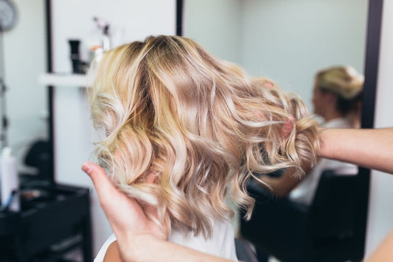 According to professional hair stylist Megan Brooks, there are multiple hairstyles to adopt if you're experiencing thinning hair -Credit:PA