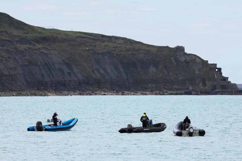 Security and rescue forces are seen on the beach of Wimereux, near Calais