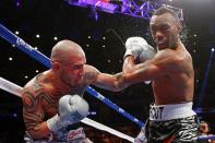 NEW YORK, NY - DECEMBER 01: Miguel Cotto (L) connects on a punch while fighting against Austin Trout in their WBA Super Welterweight Championship title fight at Madison Square Garden on December 1, 2012 in New York City. (Photo by Elsa/Getty Images)