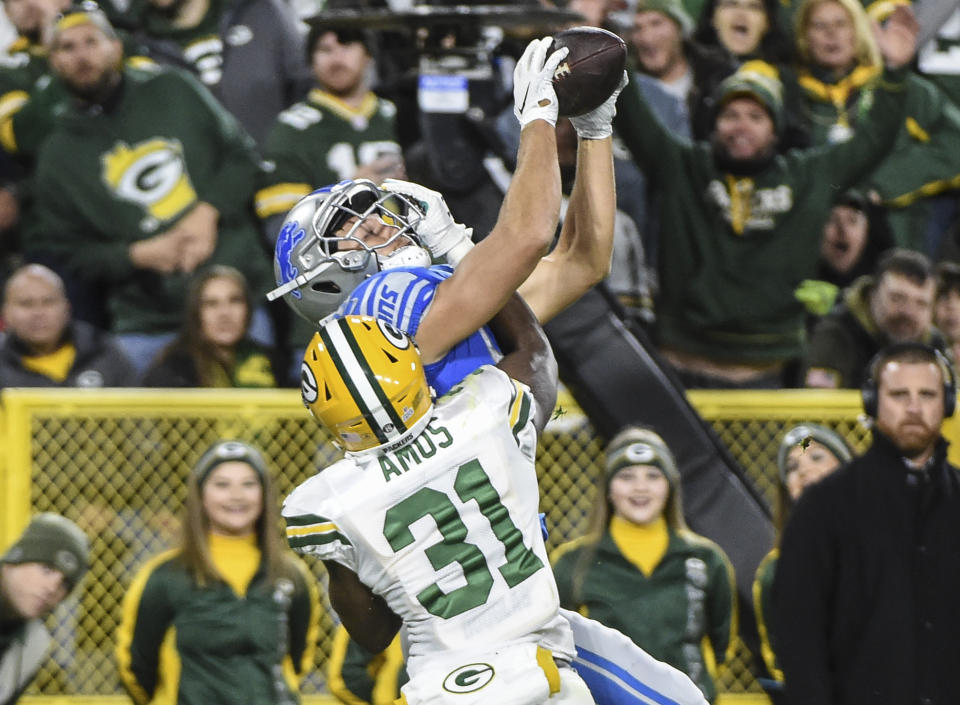 Oct 14, 2019; Green Bay, WI, USA; Detroit Lions tight end T.J. Hockenson (88) cannot hold on to the ball while defended by Green Bay Packers safety Adrian Amos (31) in the second quarter at Lambeau Field. Mandatory Credit: Benny Sieu-USA TODAY Sports