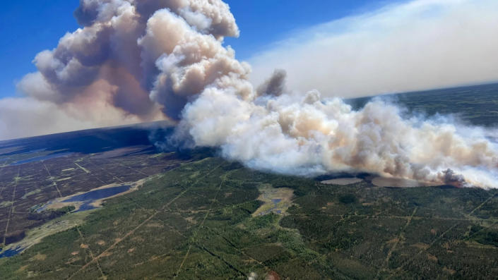 Smoke rises from a wildfire approximately 10km northwest of the community of Zama City, Alberta, Canada, on June 11. 