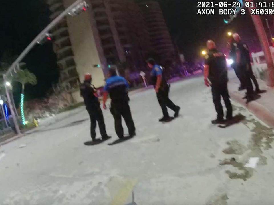 Police body camera footage shows officers on the scene of the collapsed 12-story Champlain Towers South.