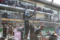 Mercedes driver Valtteri Bottas, of Finland, celebrates after coming in first in the qualifying run of the Formula One Mexico Grand Prix auto race at the Hermanos Rodriguez racetrack in Mexico City, Saturday, Nov. 6, 2021. (Francisco Guasco, Pool Photo via AP)