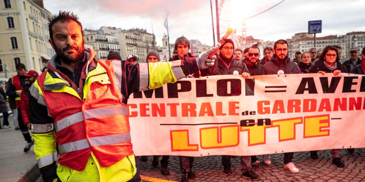 Public and private workers demonstrate and shout slogans during a mass strike against pension reforms on December 05, 2019 in Marseille, France.