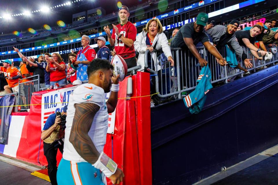 Miami Dolphins quarterback Tua Tagovailoa (1) greets the fans after the Dolphins 24-17 win over the New England Patriots during an NFL football game at Gillette Stadium on Sunday, Sept. 17, 2023 in Foxborough, MA.