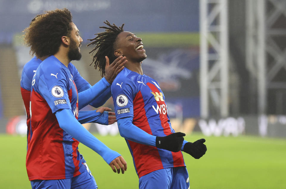 Crystal Palace's Eberechi Eze, right, celebrates after scoring his side's opening goal during the English Premier League soccer match between Crystal Palace and Wolverhampton Wanderers at Selhurst Park stadium in London, England, Saturday, Jan. 30, 2021. (Julian Finney/Pool via AP)
