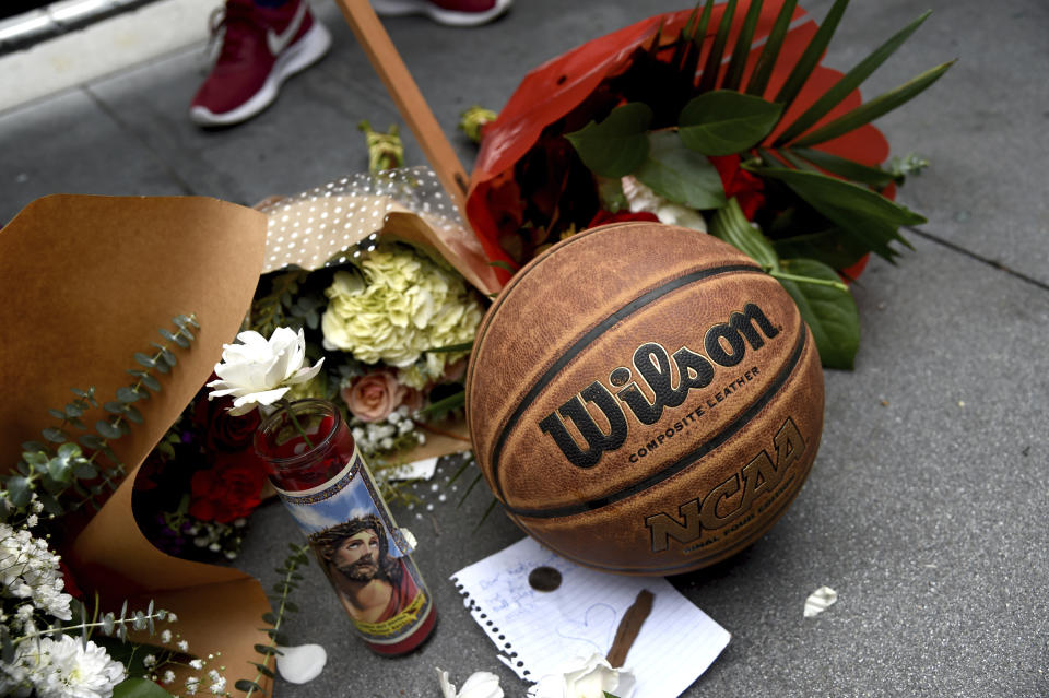 A makeshift memorial honoring former NBA basketball player Kobe Bryant appears outside of Staples center prior to the start of the 62nd annual Grammy Awards on Sunday, Jan. 26, 2020, in Los Angeles. Bryant died Sunday in a helicopter crash near Calabasas, Calif. He was 41. (AP Photo/Chris Pizzello)