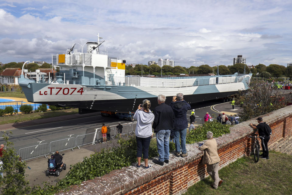 Restored World War Two landing craft LCT 7074 is transported from from the Naval Base in Portsmouth to its final resting place at the D-Day Story at Southsea.