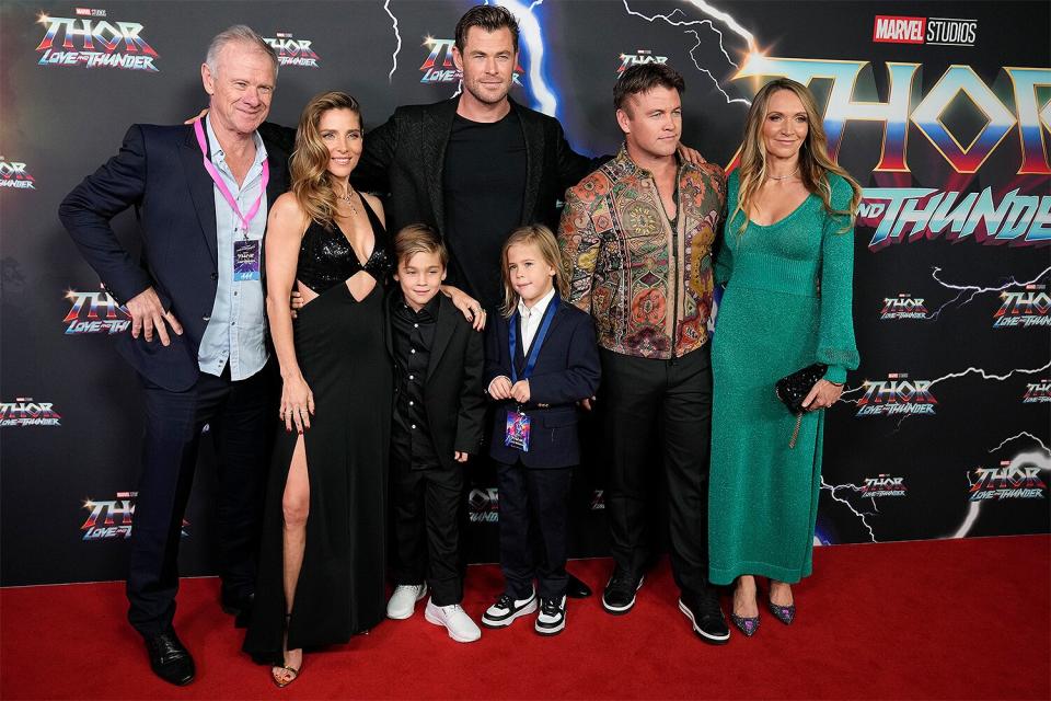 Australian actor Chris Hemsworth and his wife Elsa Pataky pose for a photo with their twin sons Tristan and Sasha, his father Craig (left) and his brother Luke and his wife Samantha (right) during a red carpet for the film premiere of "Thor: Love and Thunder" at the Entertainment Quarter in Sydney, Australia, Monday, June 27, 2022.