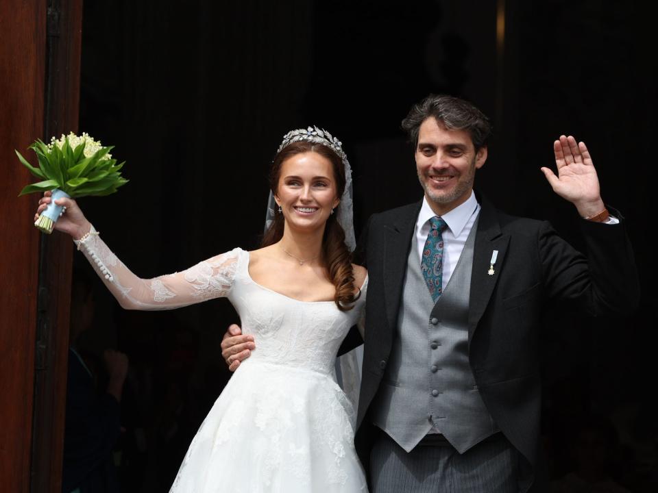 Princess Sophie and Prince Ludwig of Bavaria wave on their wedding day.