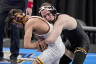 Iowa's Spencer Lee, right, takes on Arizona State's Brandon Courtney during their 125-pound match in the finals of the NCAA wrestling championships Saturday, March 20, 2021, in St. Louis. (AP Photo/Jeff Roberson)