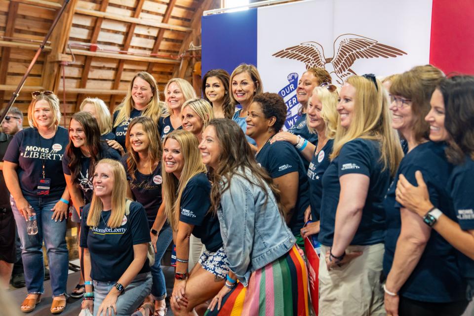 Florida first lady Casey DeSantis and Iowa Gov. Kim Reynolds take a photo with the audience during an event in Johnston, Thursday, July 6, 2023.